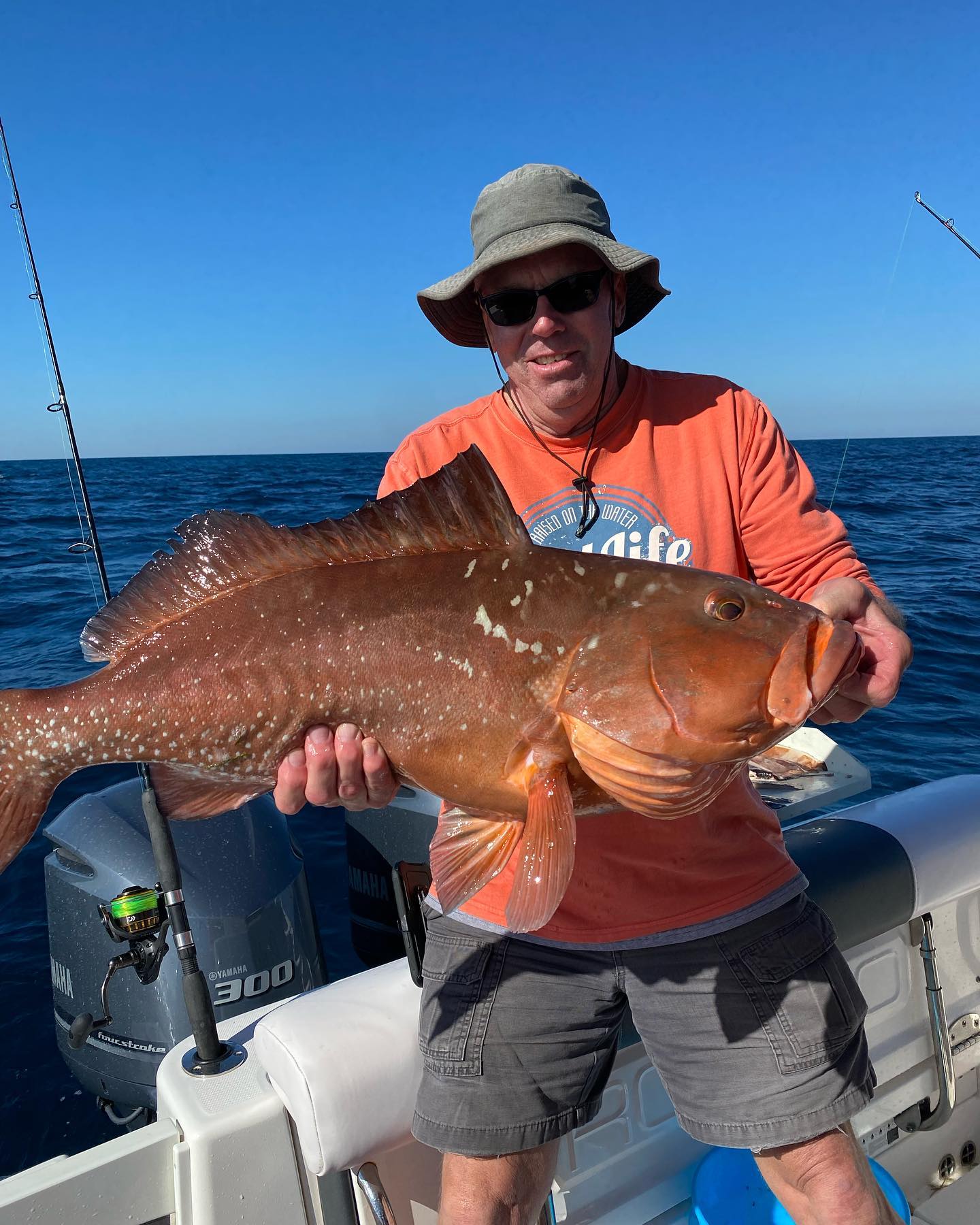 Angler holding a 29-inch fish while fishing in FL