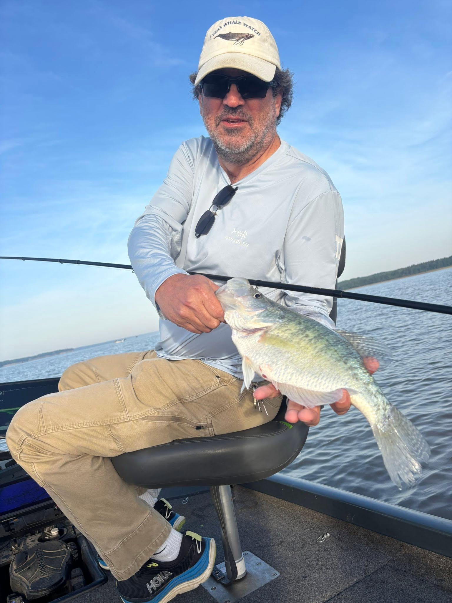 Angler holding freshly caught fish on boat in Batesville MS