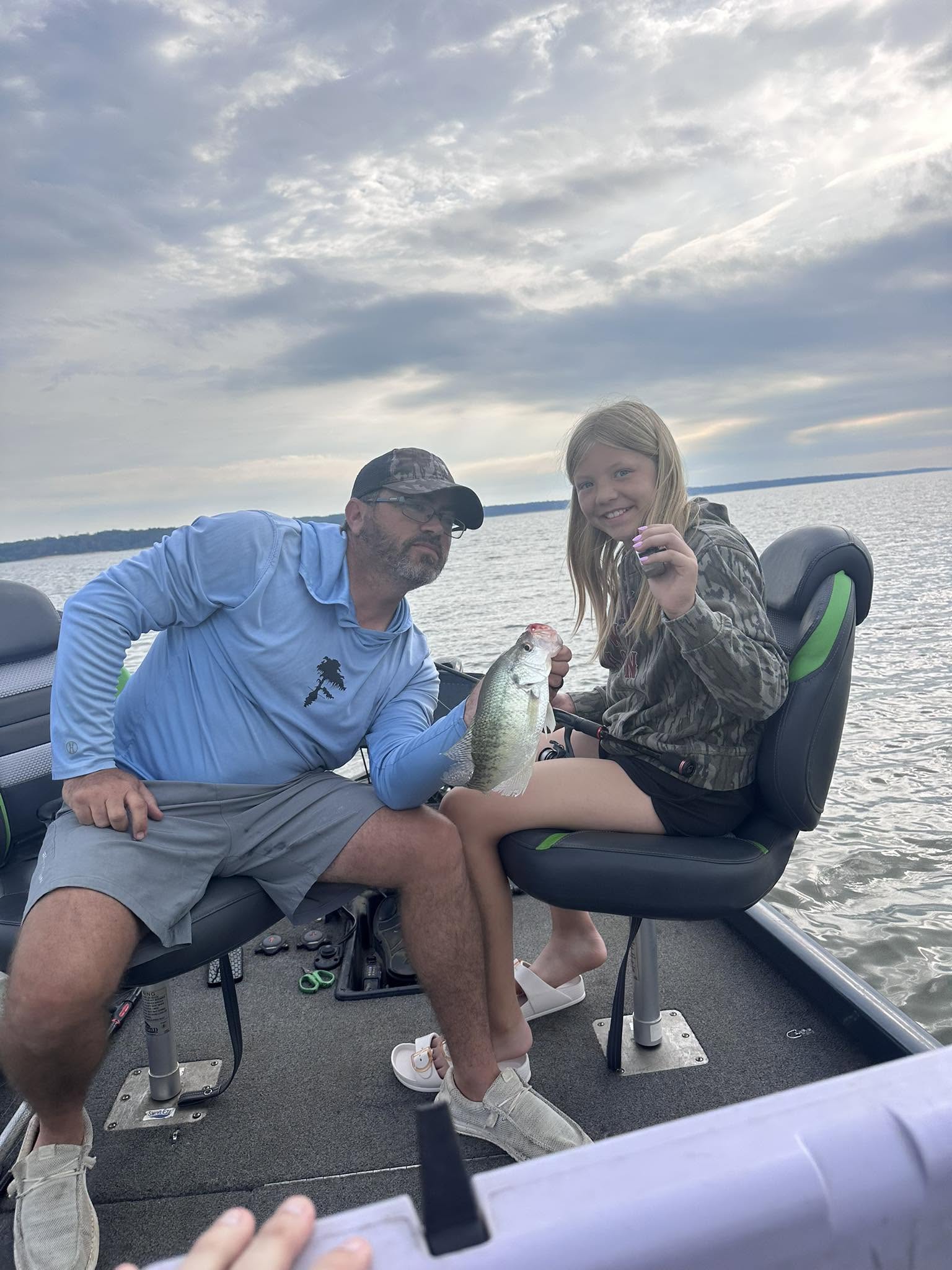 Fishing trip on lake in Batesville MS with fresh caught fish displayed on boat