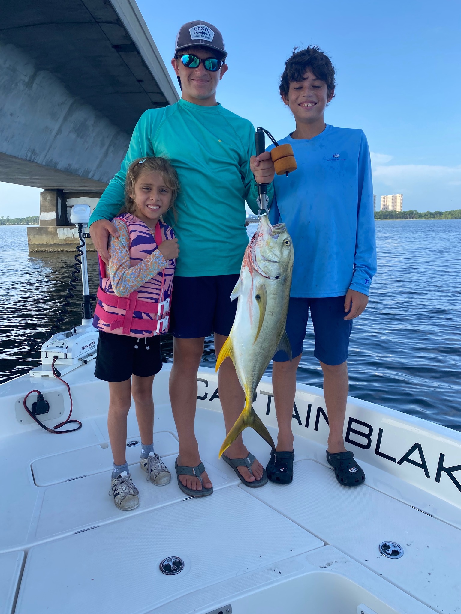 Crevalle Jack fish caught by three people in Destin
