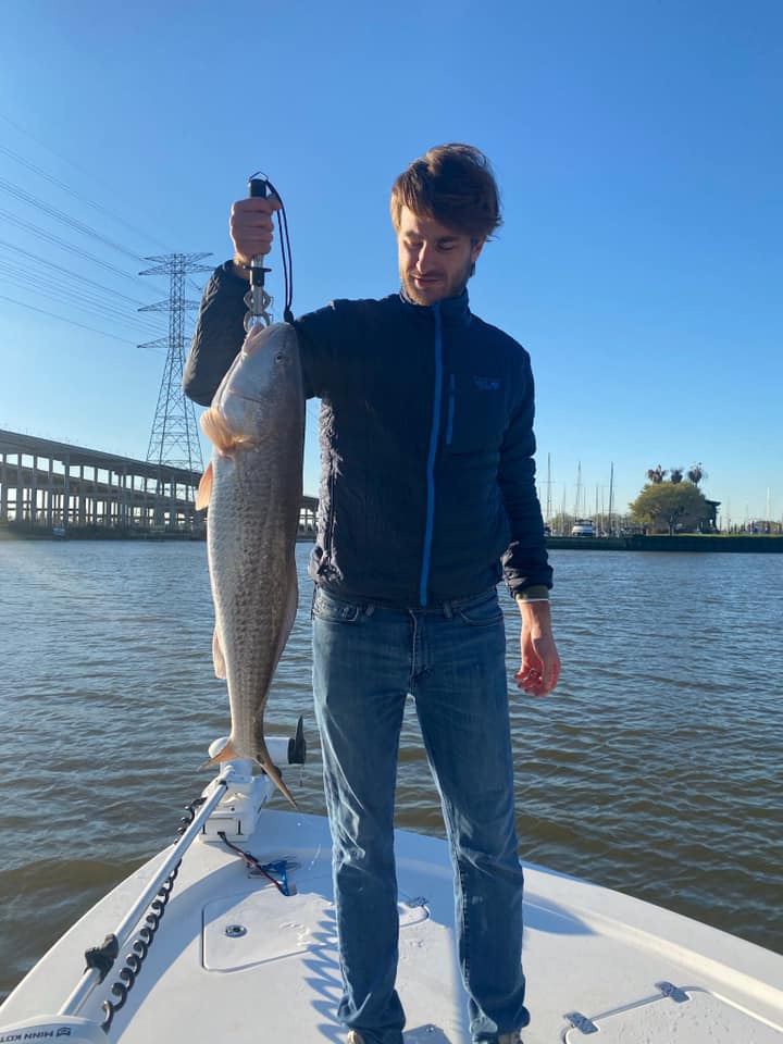 Single angler holding a 28-inch fish in TX