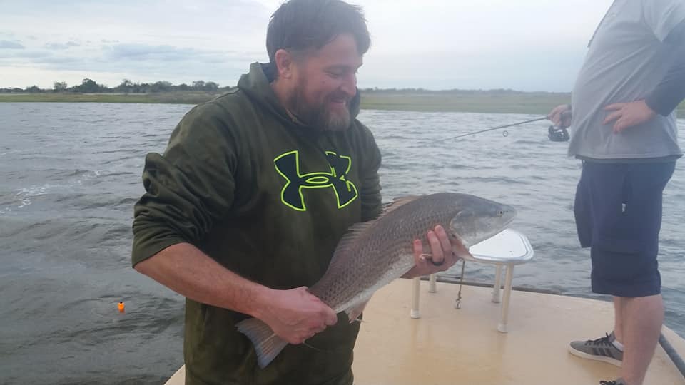 One fisherman reeling in a catch at North Topsail Beach
