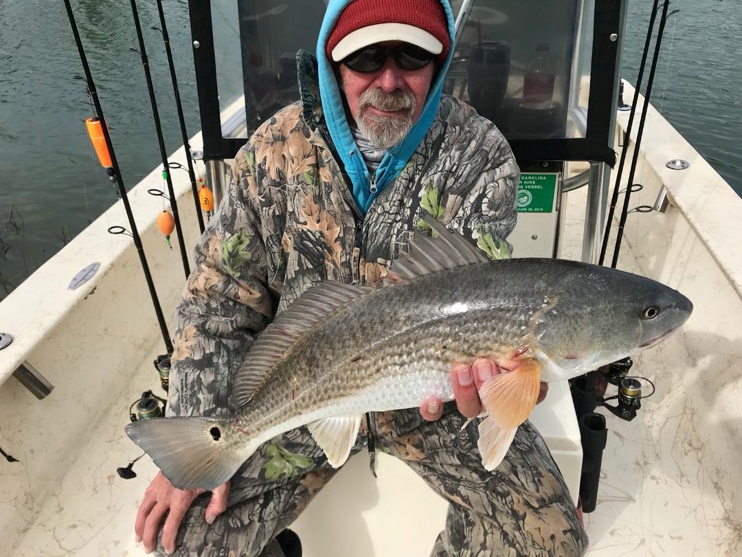 Angler catches a 25-inch redfish at North Topsail Beach