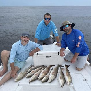 Three people fishing in Orange Beach