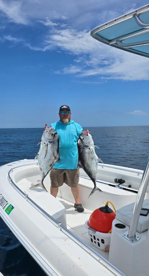 Fishing boat displaying catch of two large fish on deck in St. Augustine FL waters