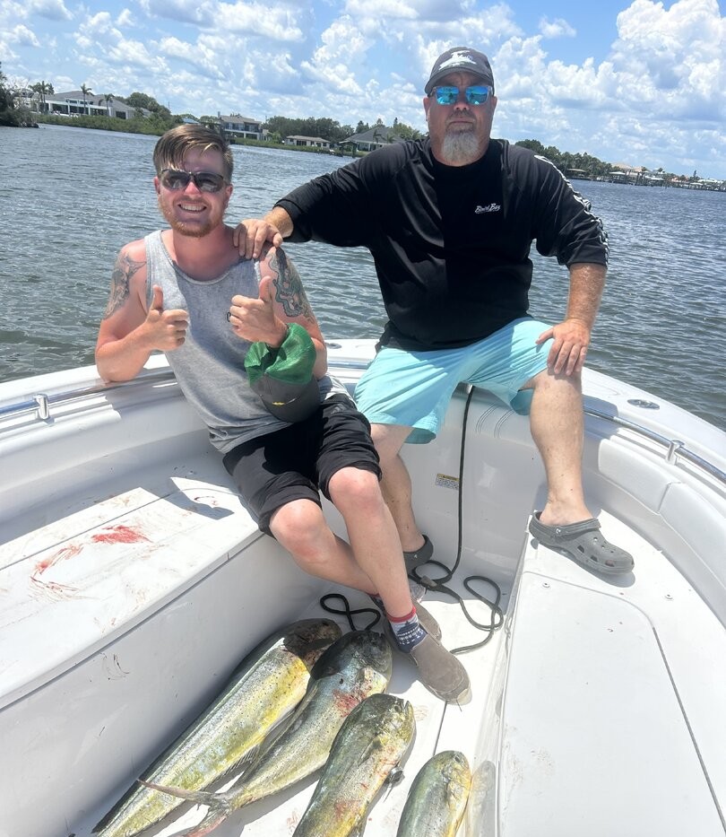 Successful mahi mahi fishing trip on boat in St. Augustine FL waters with fresh catch displayed