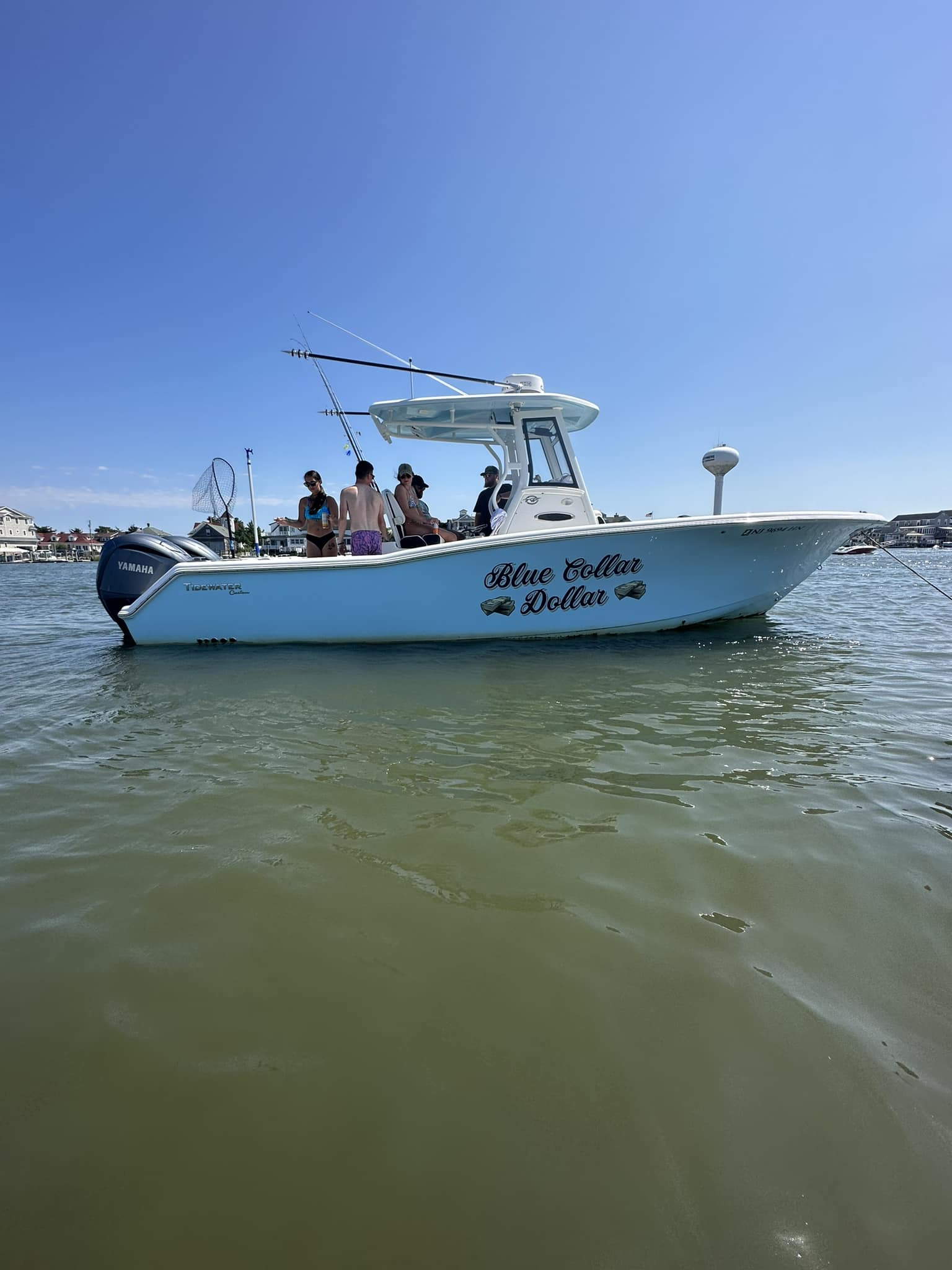 Four people fishing in the ocean in Ocean City