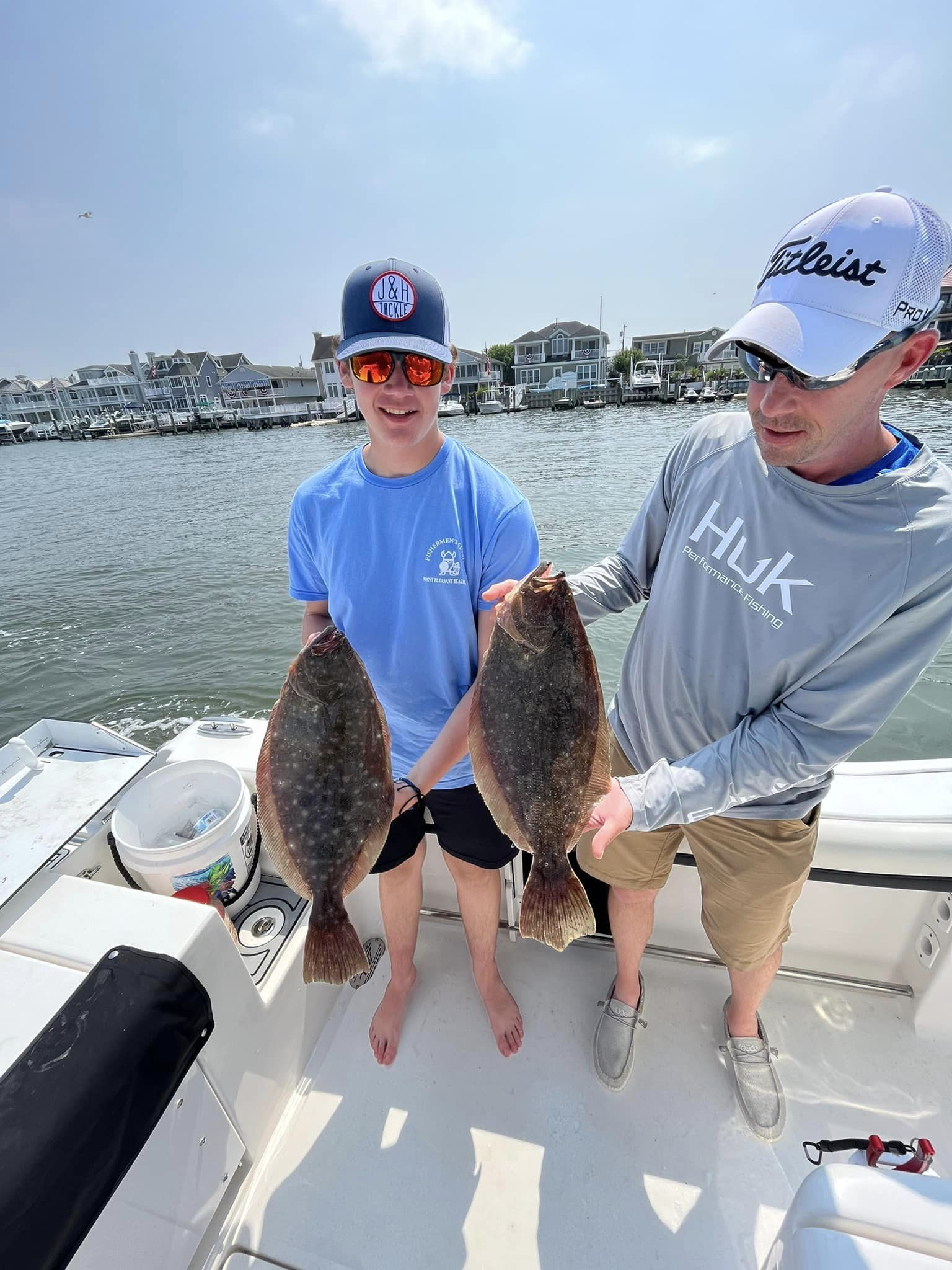 Two summer flounder and southern flounder caught fishing in NJ