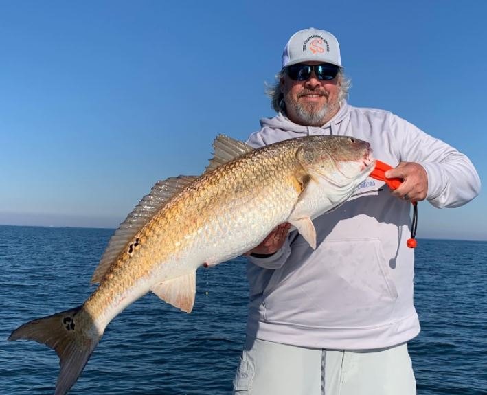 Angler holding a 26-inch fish in SC