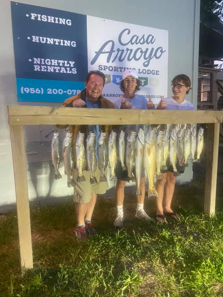 Two anglers with a great catch of 18-inch fish on an unknown location