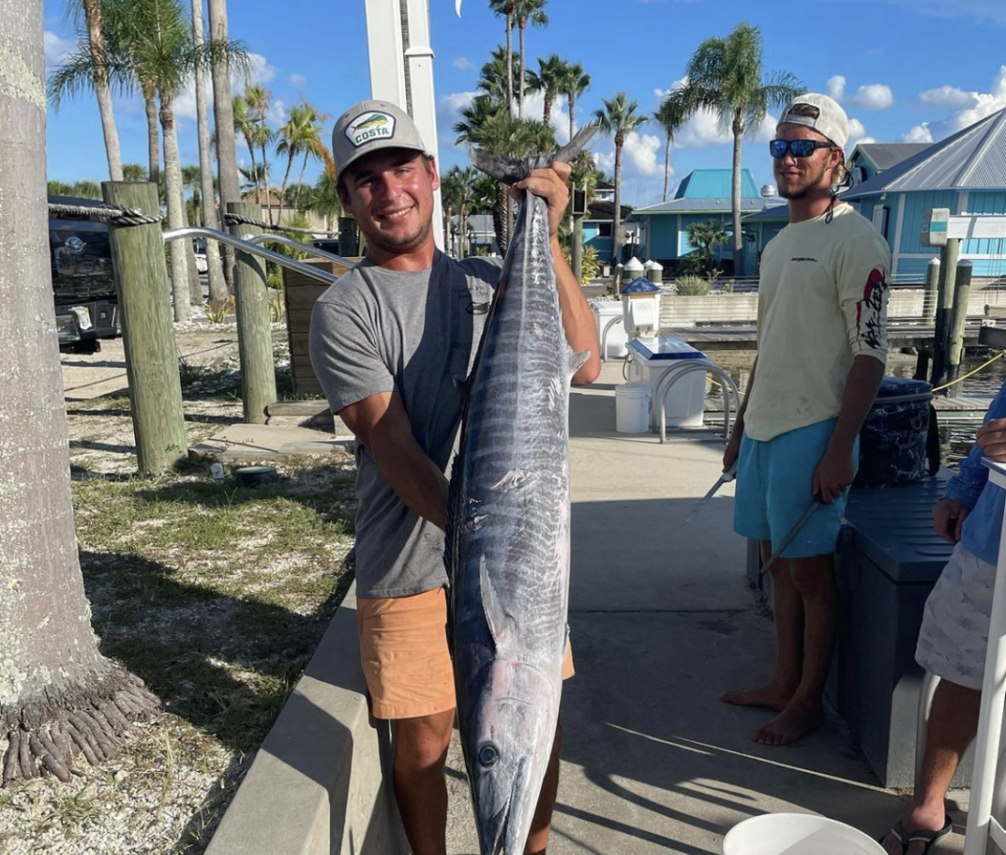 Two people fishing with rod and reel at Ponce Inlet