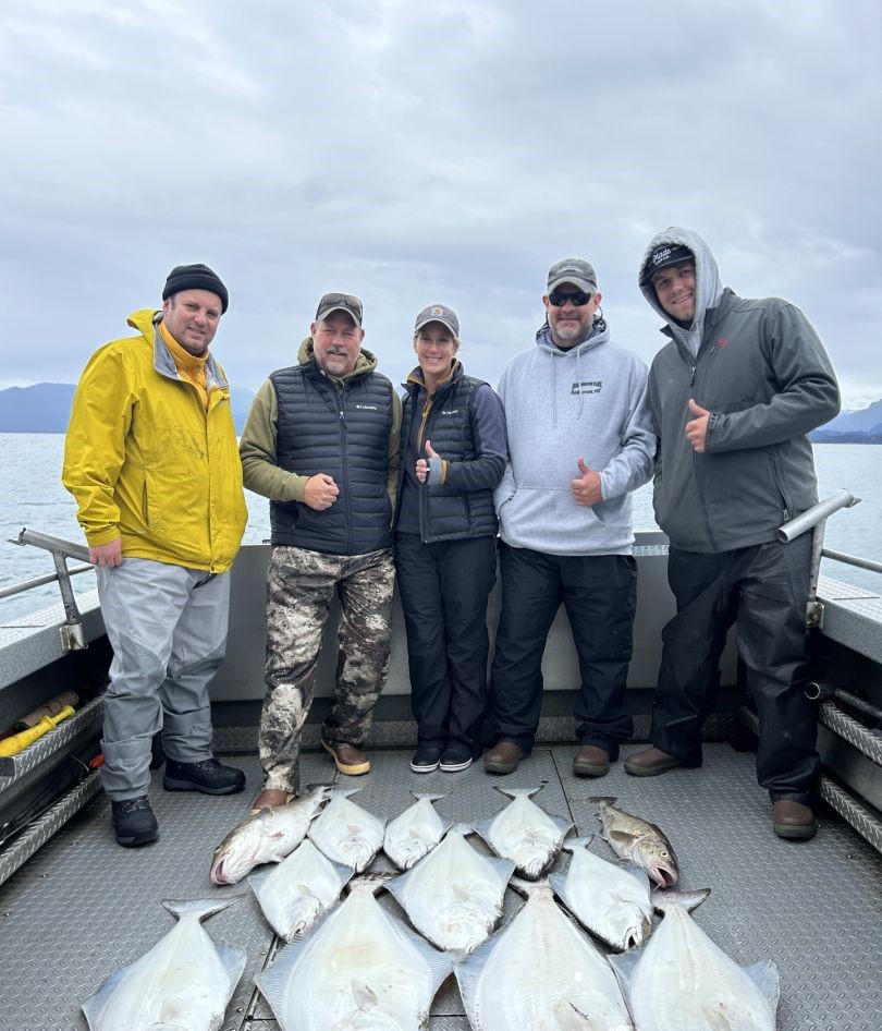 5 people fishing in Alaska