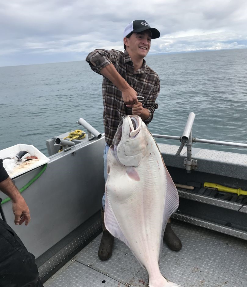 Photograph of a large Pacific Halibut caught while fishing in Alaska