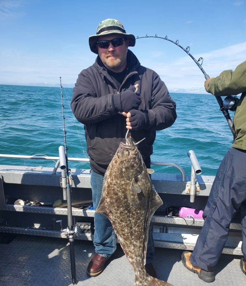 Impressive catch of a Pacific halibut in Alaska