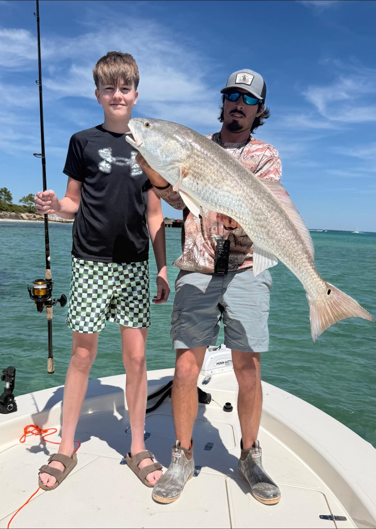 Successful redfish catch on fishing charter boat in Pensacola FL waters