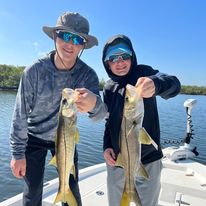 Two fishermen with a big catch of fish in Florida