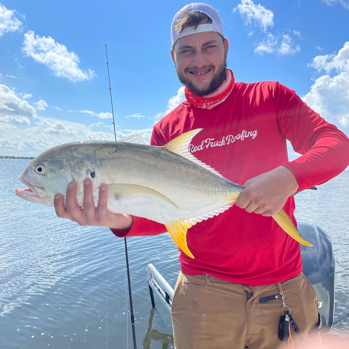 Angler with a crevalle jack fish caught in St. Petersburg