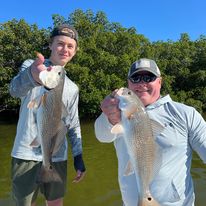 Two anglers fishing in Florida with big fish