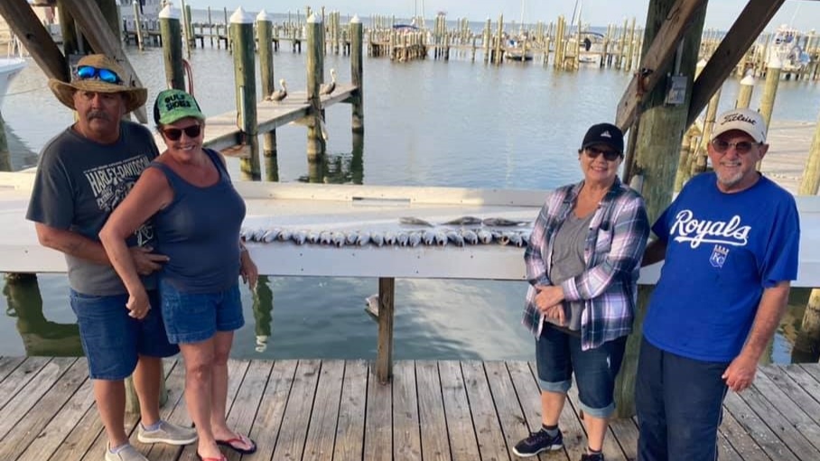 Four people fishing in Gulf Shores