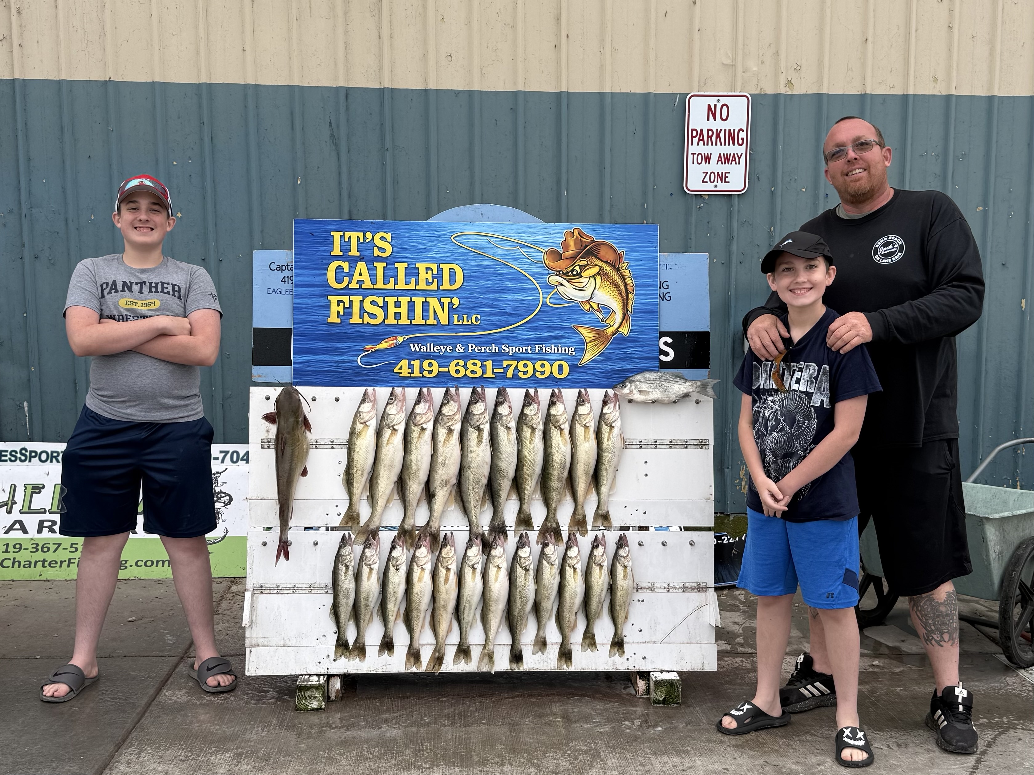 Successful walleye fishing charter displaying catch of multiple walleye at Lakeside Marblehead OH
