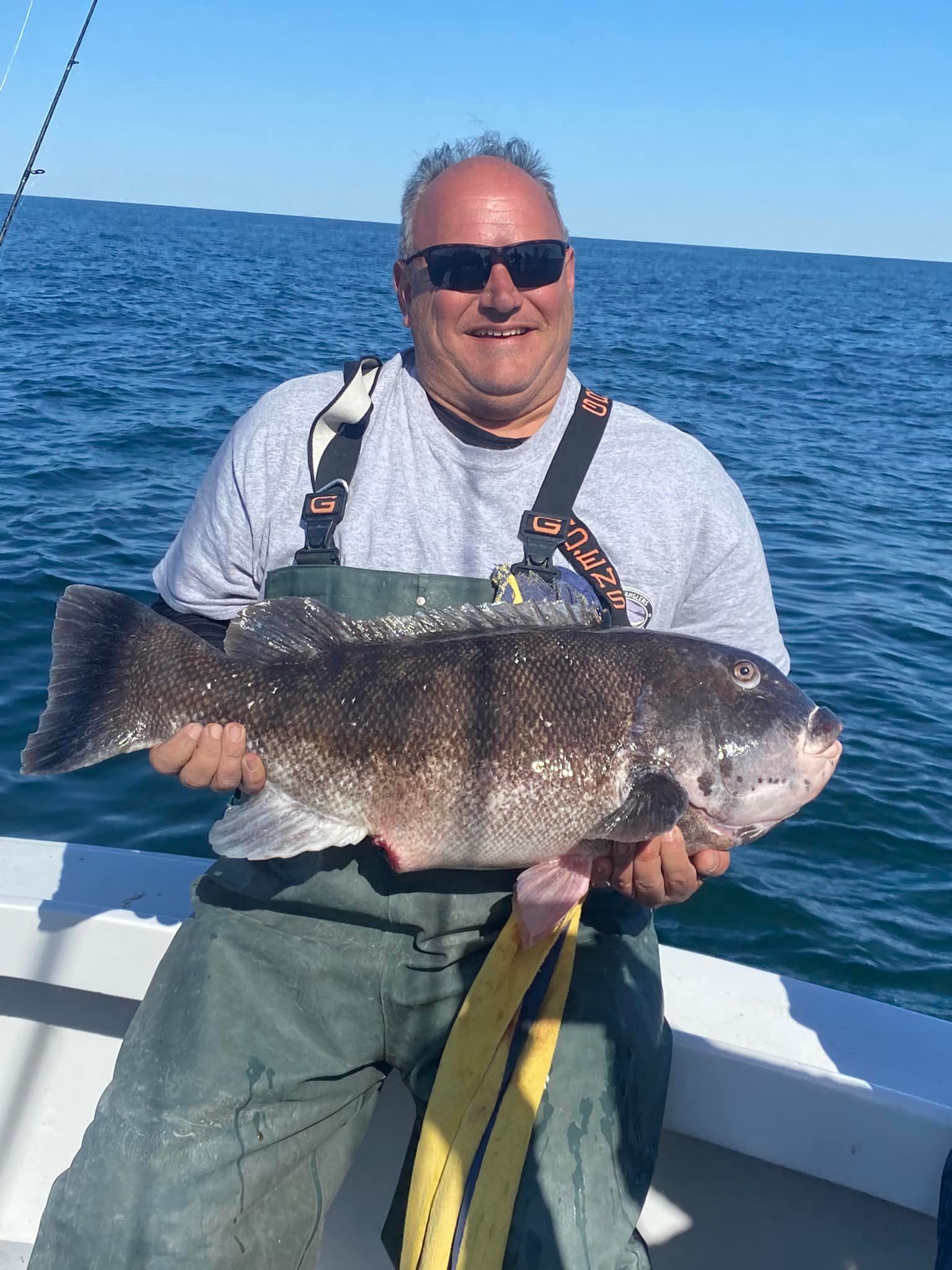 A single fisherman with a big 23-inch catch during a fishing trip