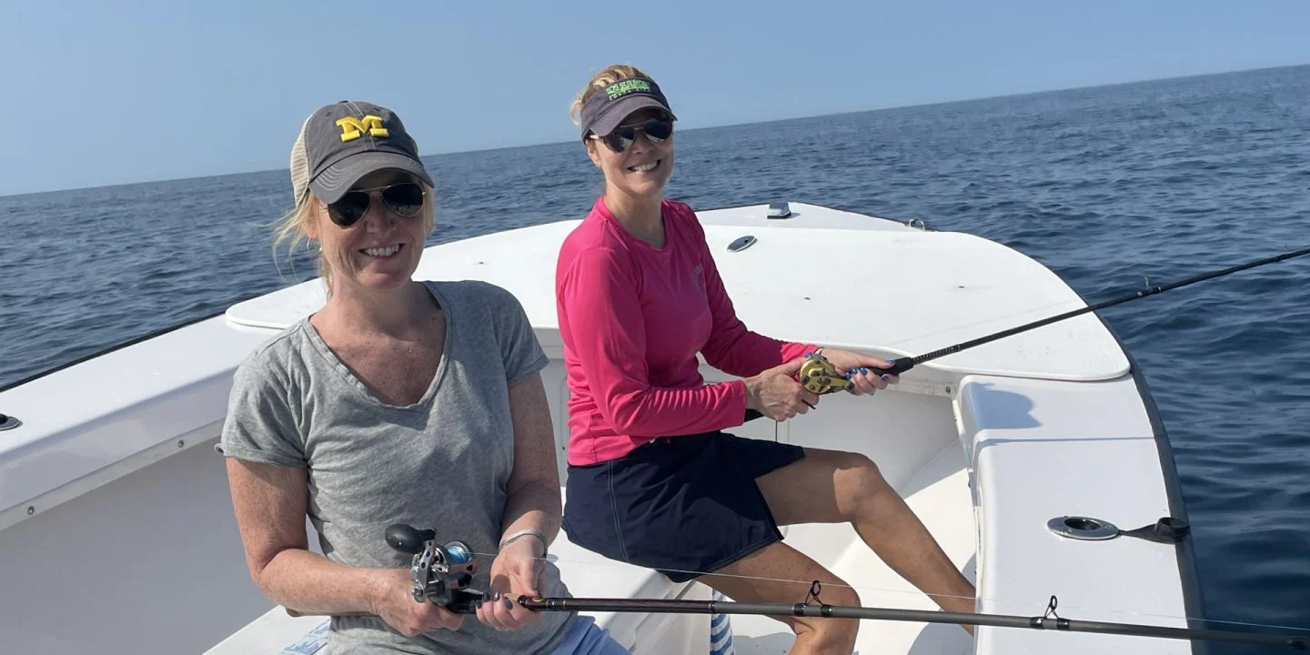 Two people enjoying fishing in DE