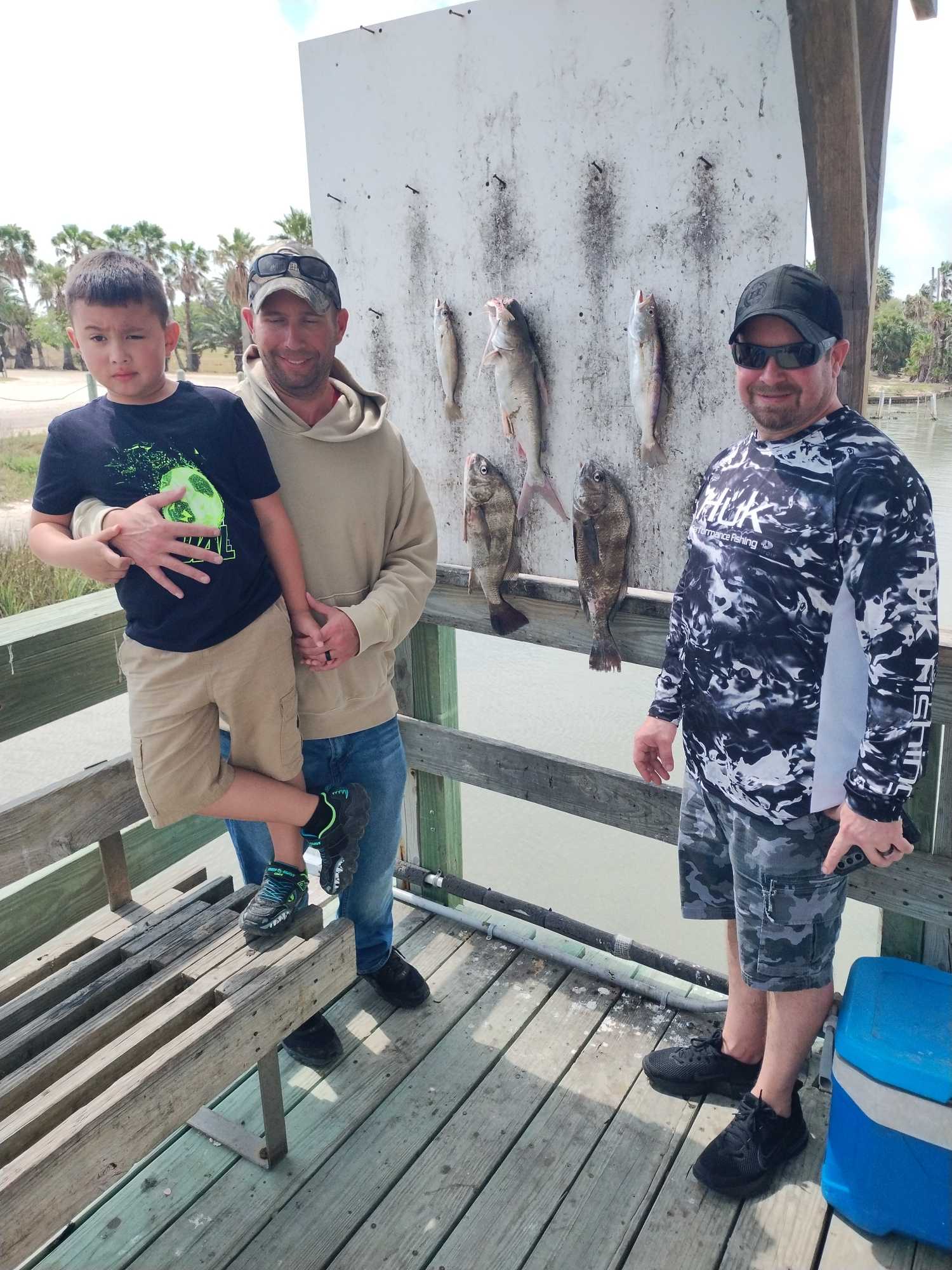Fishing catch display showing hardhead sea catfish and black drum on cleaning station in Corpus Christi TX