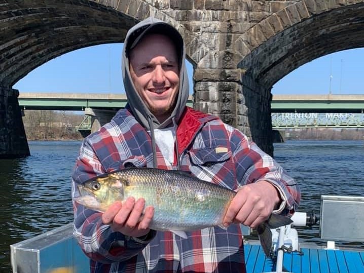 Angler with a 15-inch fish caught in NJ