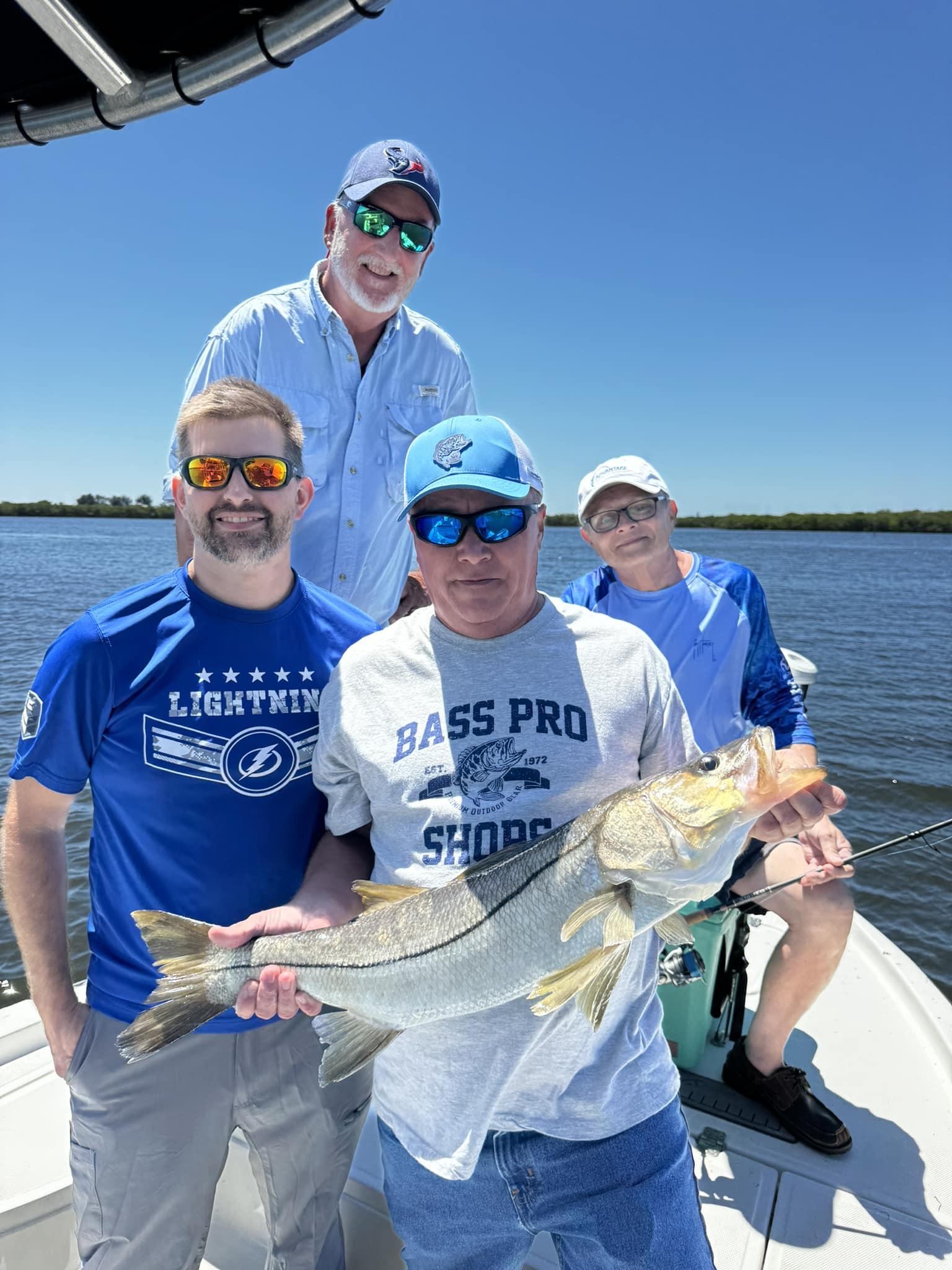 A group of 4 people fishing for snook in FL