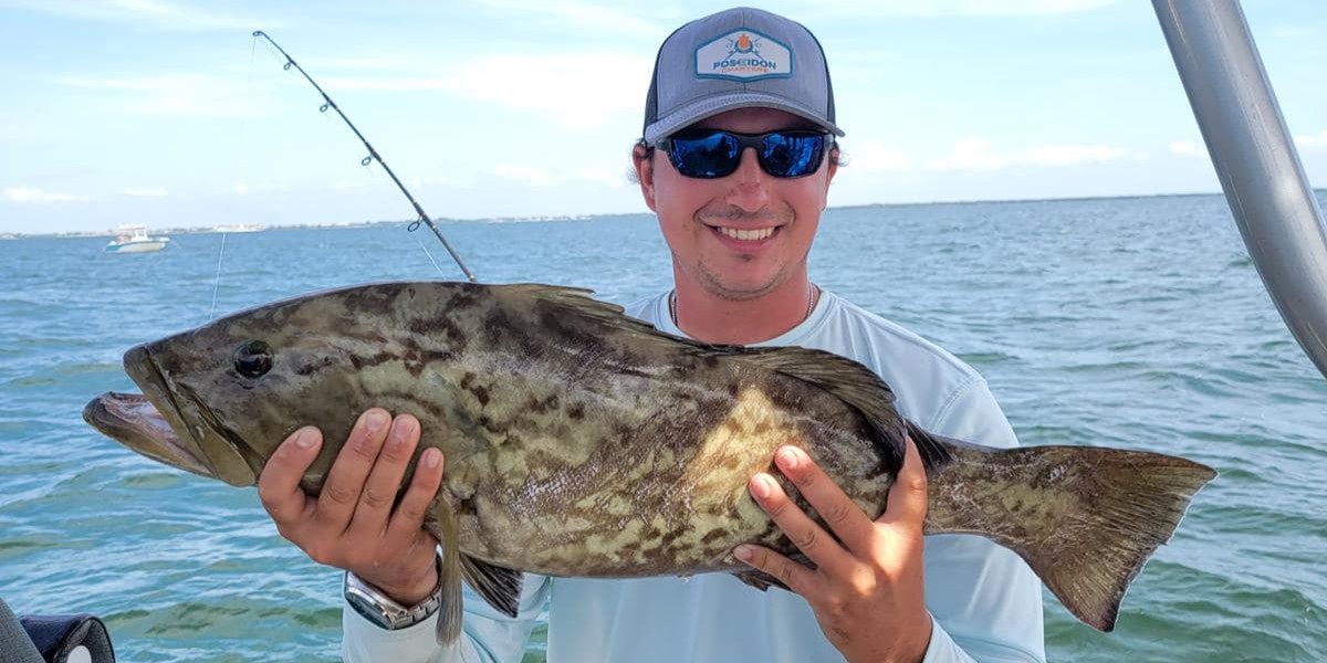 Tampa Bay inshore fishing charter boat with anglers catching snook and redfish in Florida waters