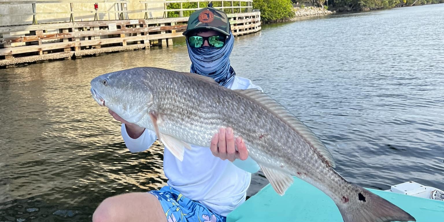 Tampa Bay offshore fishing charter boat with anglers catching grouper and mackerel