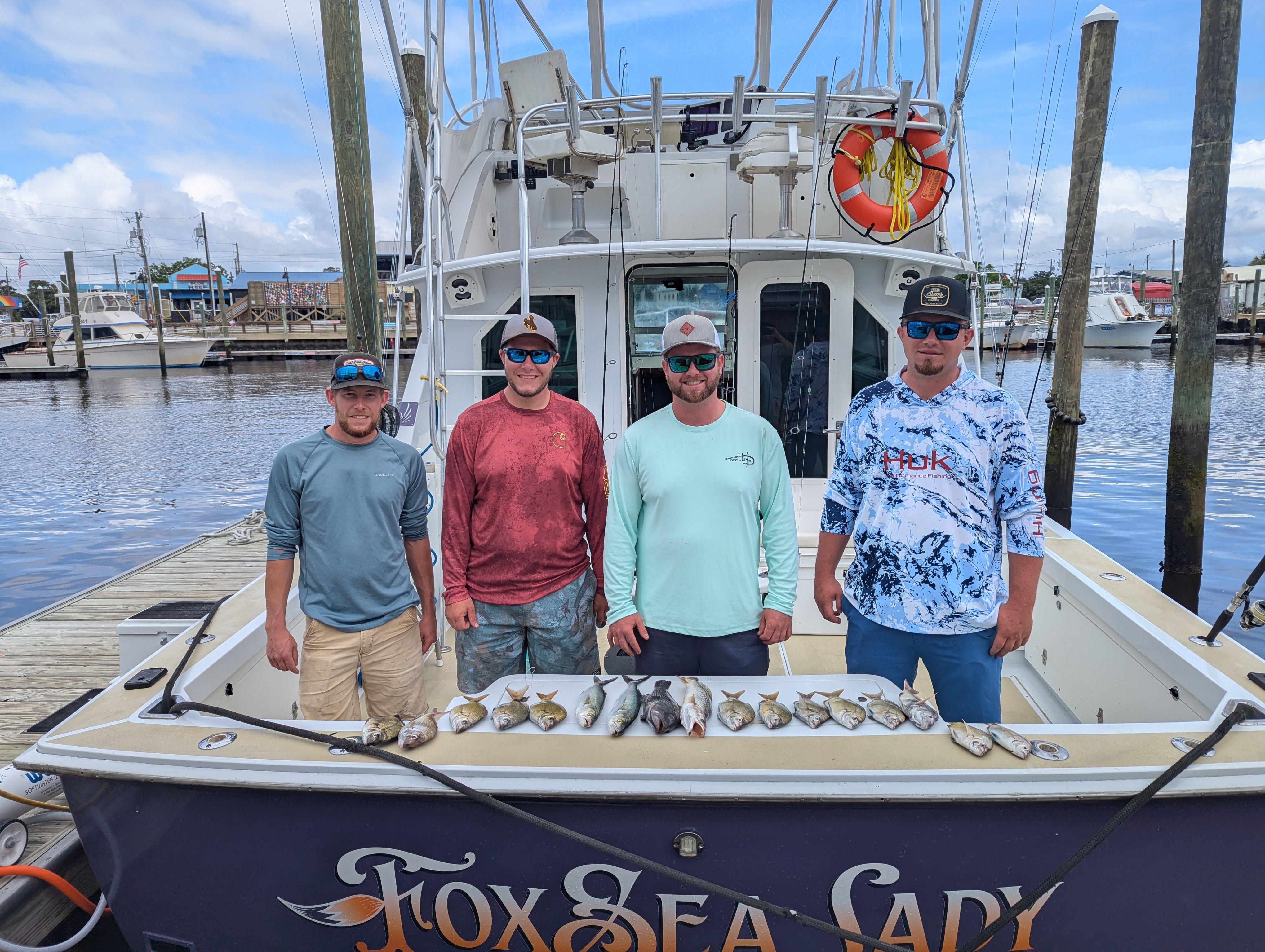 Four friends enjoying a fishing trip in NC