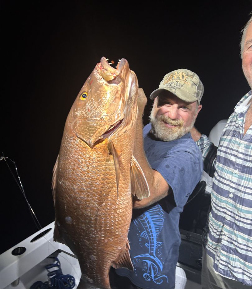 Angler holding a 23-inch fish in FL