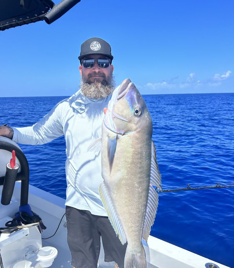 Anglers holding a large fish on Stock Island