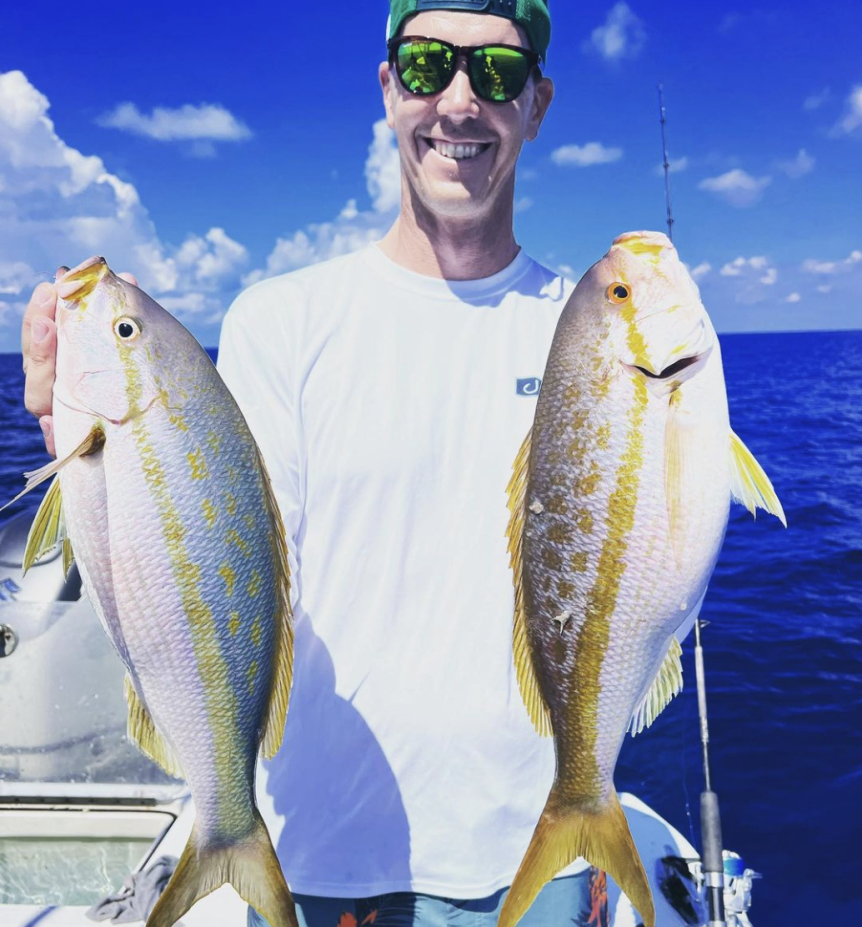 Angler fishing in Florida with 2 big fish