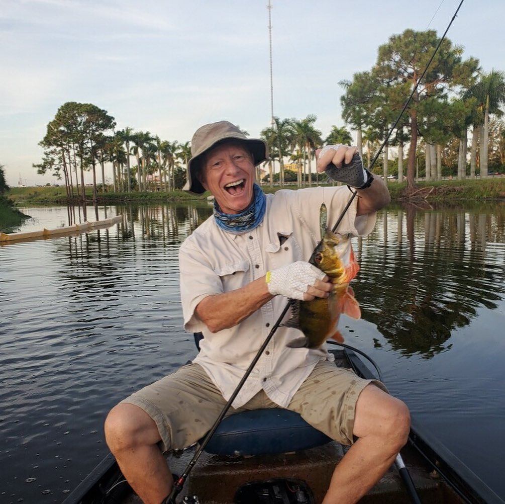 1 angler posing in front of scenic Fort Lauderdale