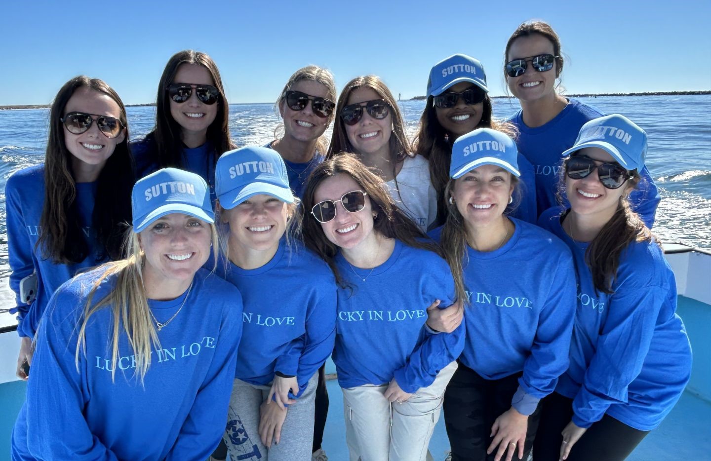 Group fishing charter boat trip in Destin FL with clear blue skies and ocean waters