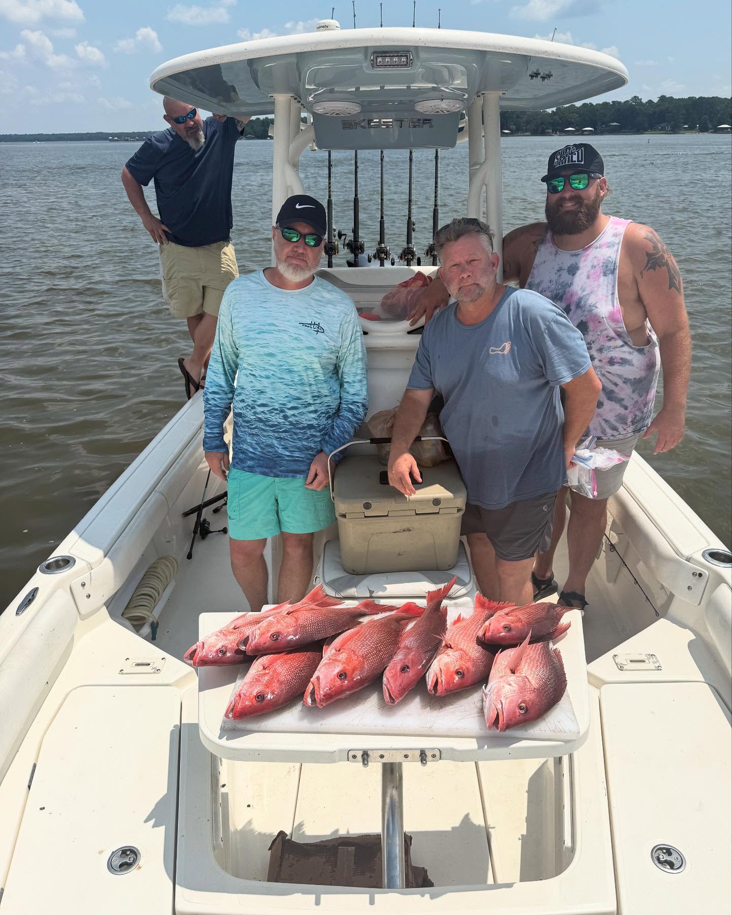 Group of 4 people fishing in the Gulf Shores of Alabama