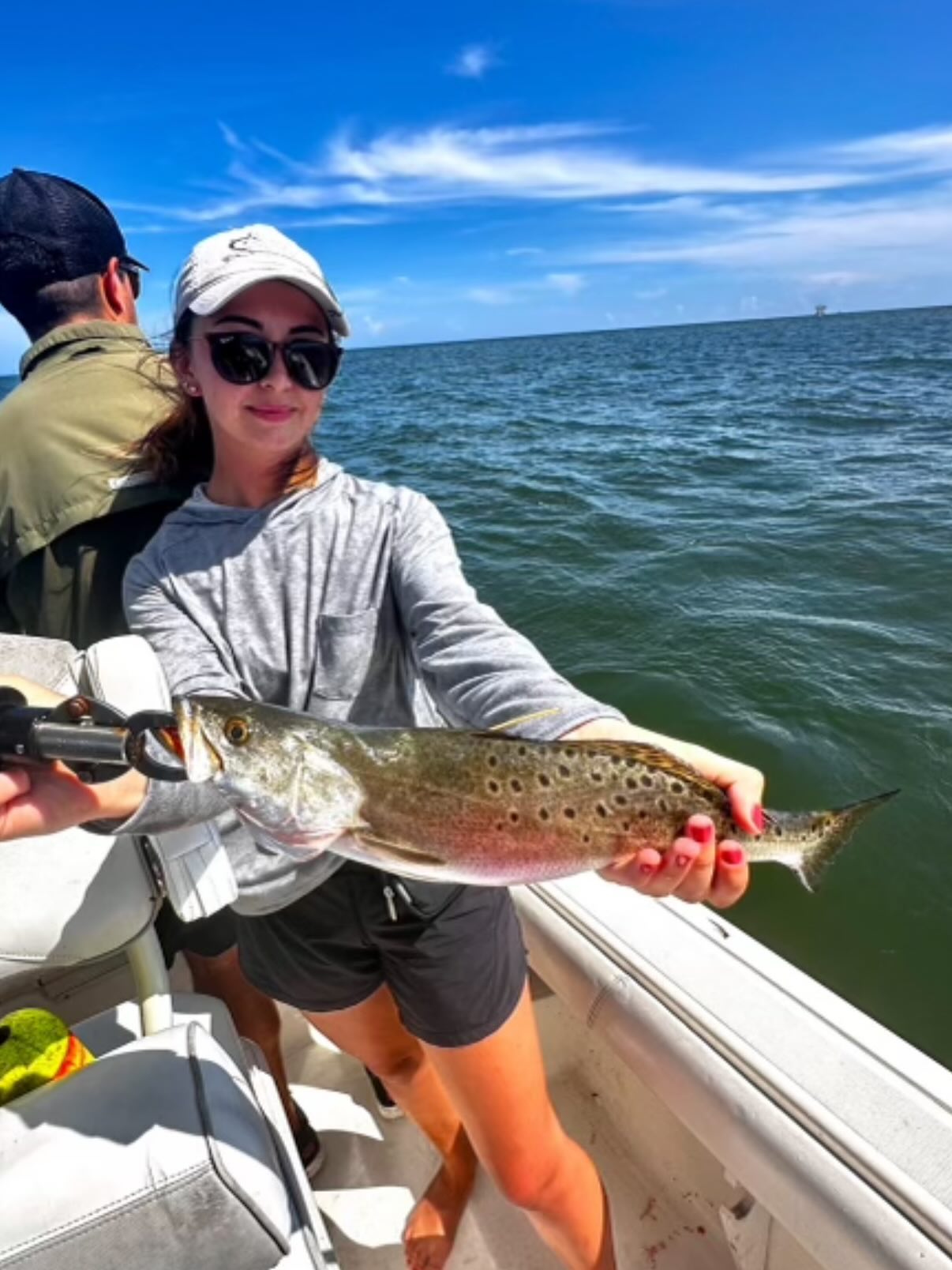 A person fishing in the waters of Gulf Shores