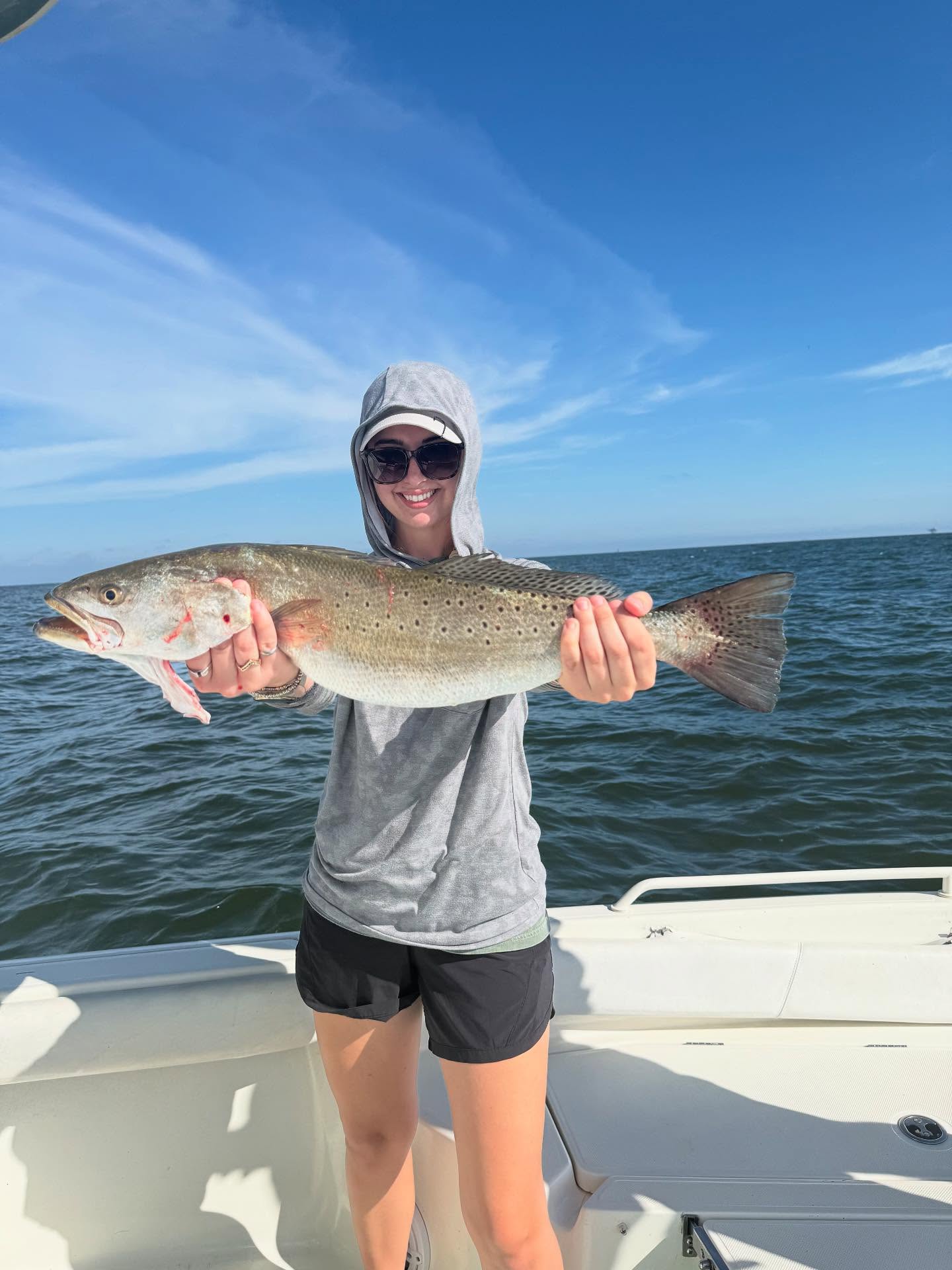 Angler with a rainbow trout in Alabama