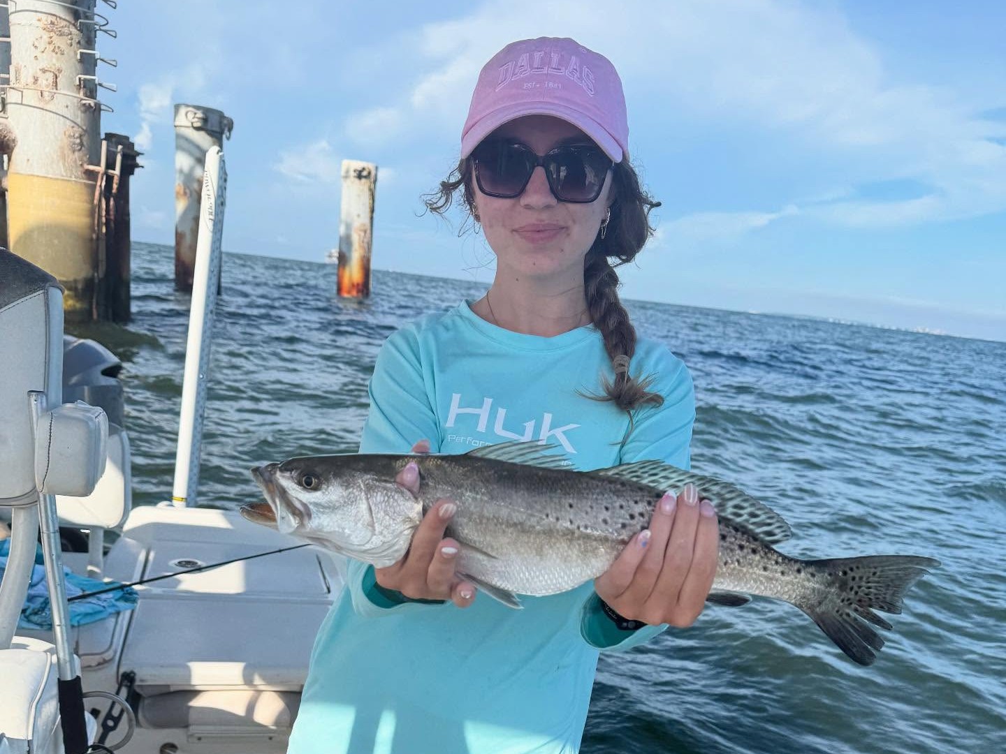 Gulf Shores Alabama inshore fishing charter boat with anglers catching redfish and sea trout
