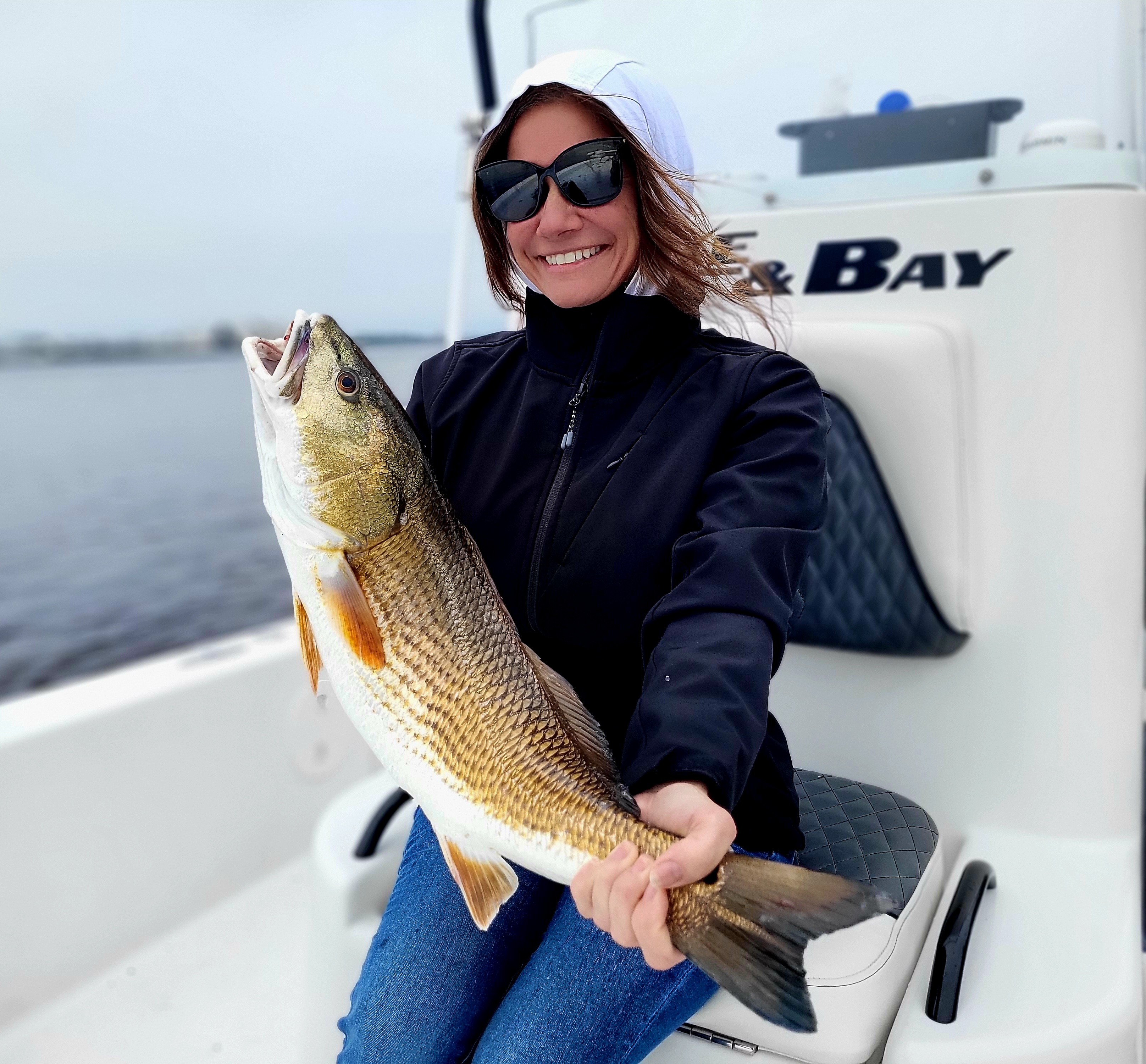 A fisherman reeling in a big catch in Florida
