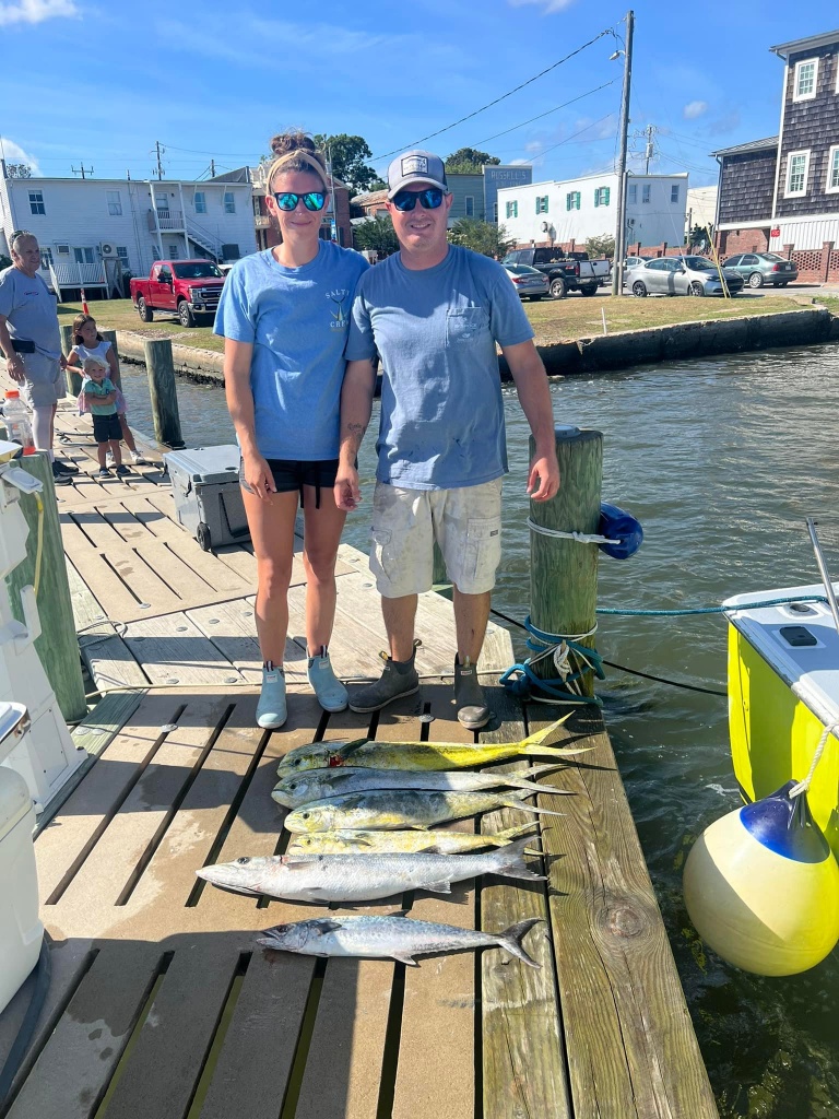 Three anglers with a 24-inch fish in Swansboro