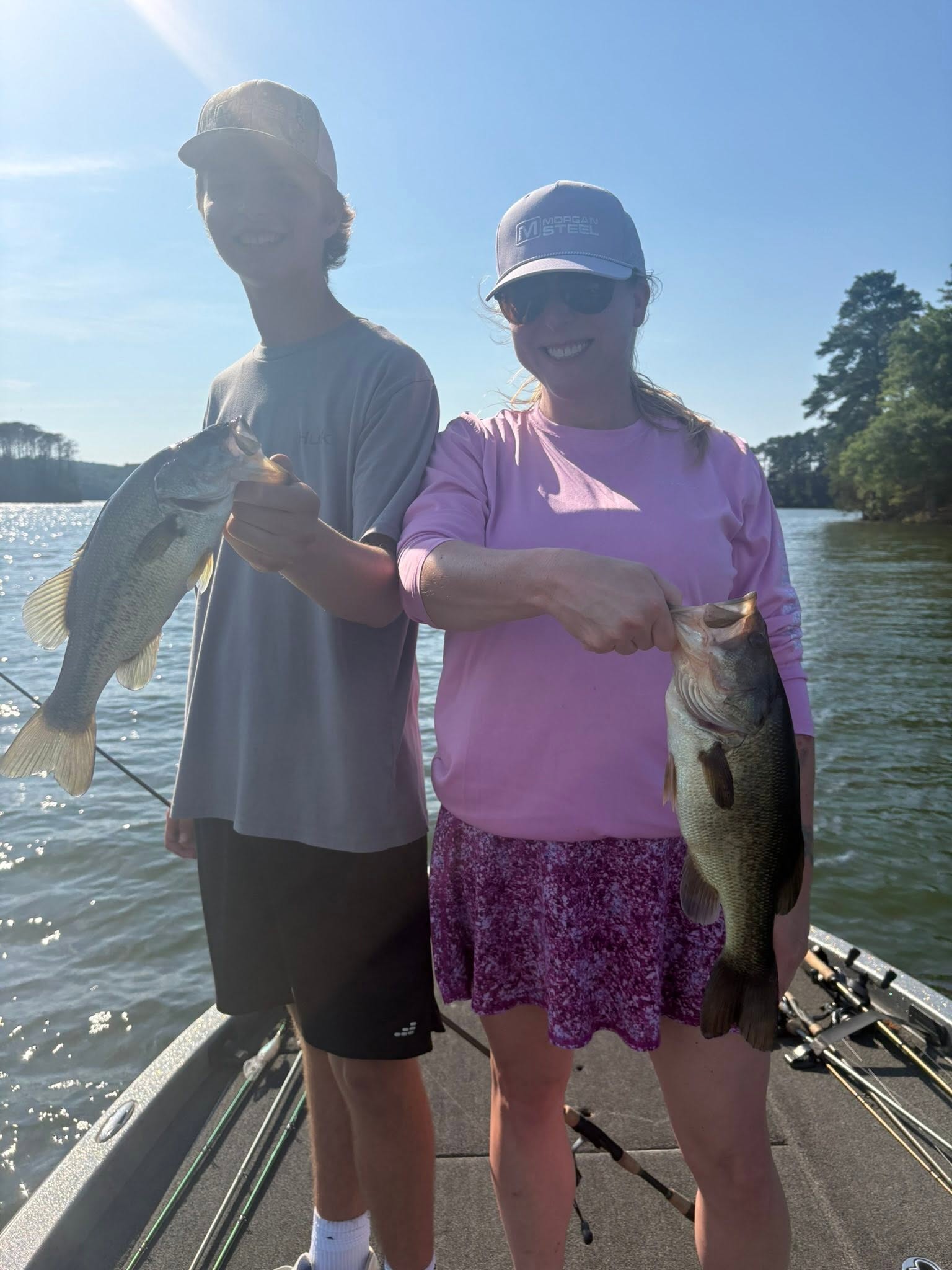 Two freshly caught fish displayed on boat deck in Guntersville AL