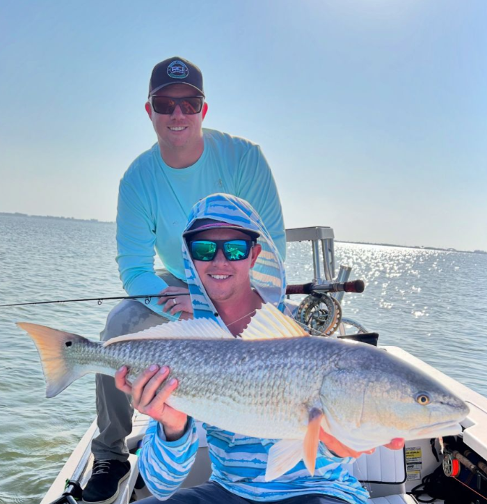 Angler holding a large redfish in Florida