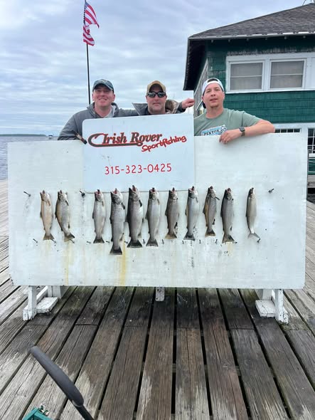 Fishing charter display showing catch of multiple fish on dock in Ogdensburg NY