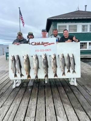 Fishing charter display showing multiple caught fish on dock in Ogdensburg NY