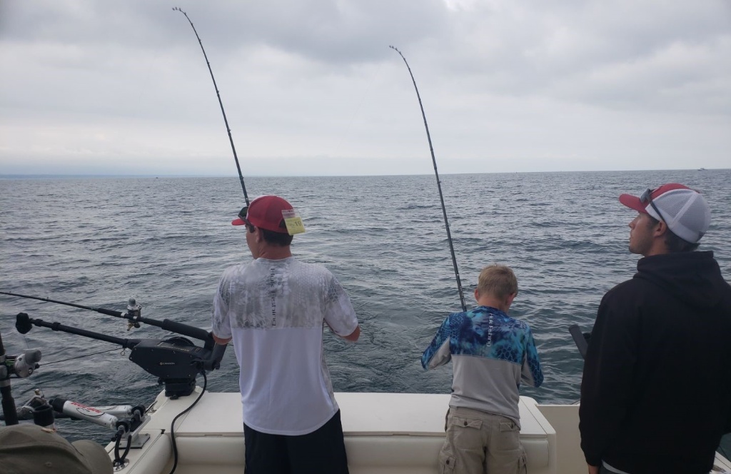Three people enjoying a great fishing trip in Erie