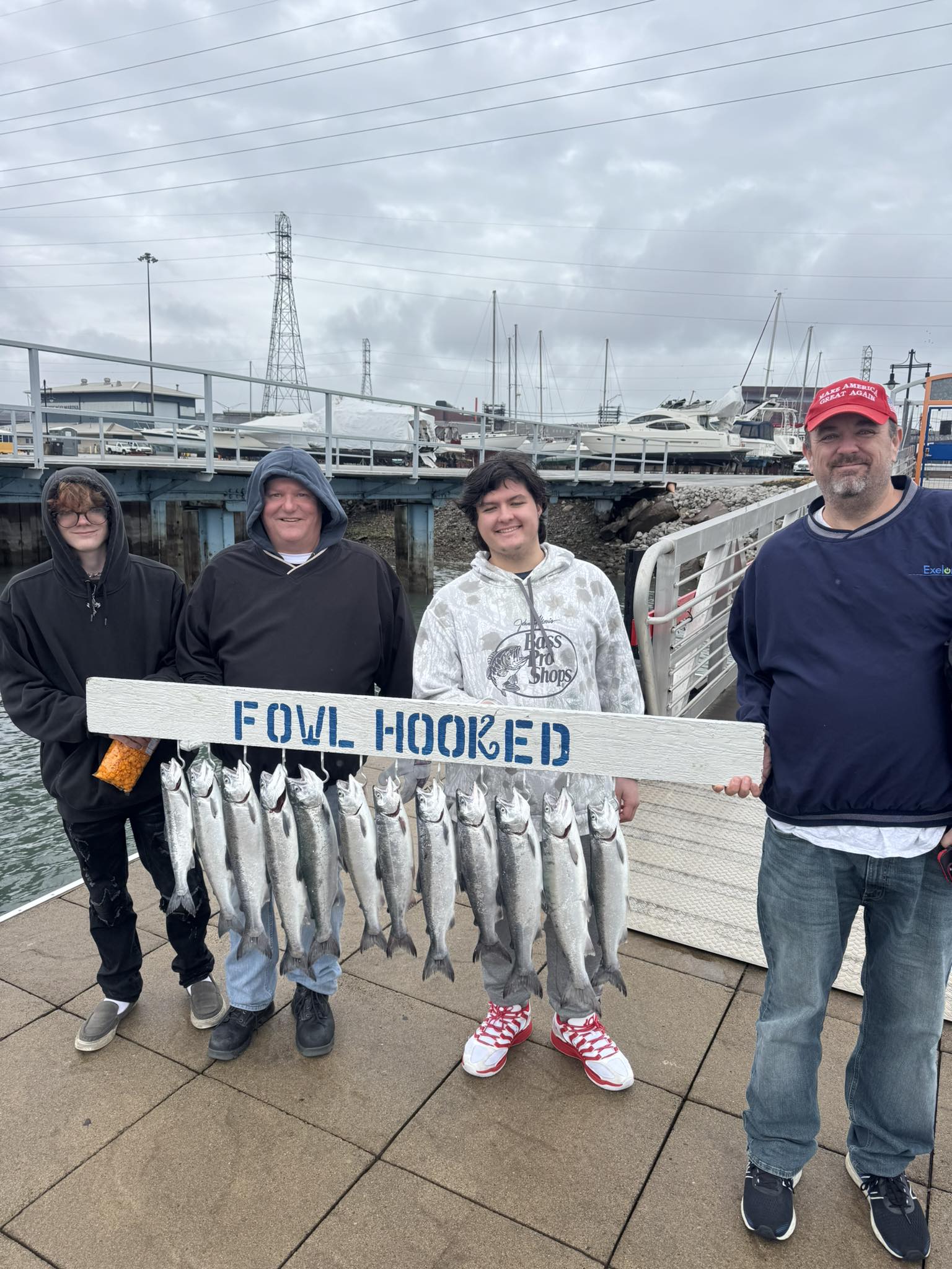 Successful coho salmon fishing charter displaying fresh catch in East Chicago IN