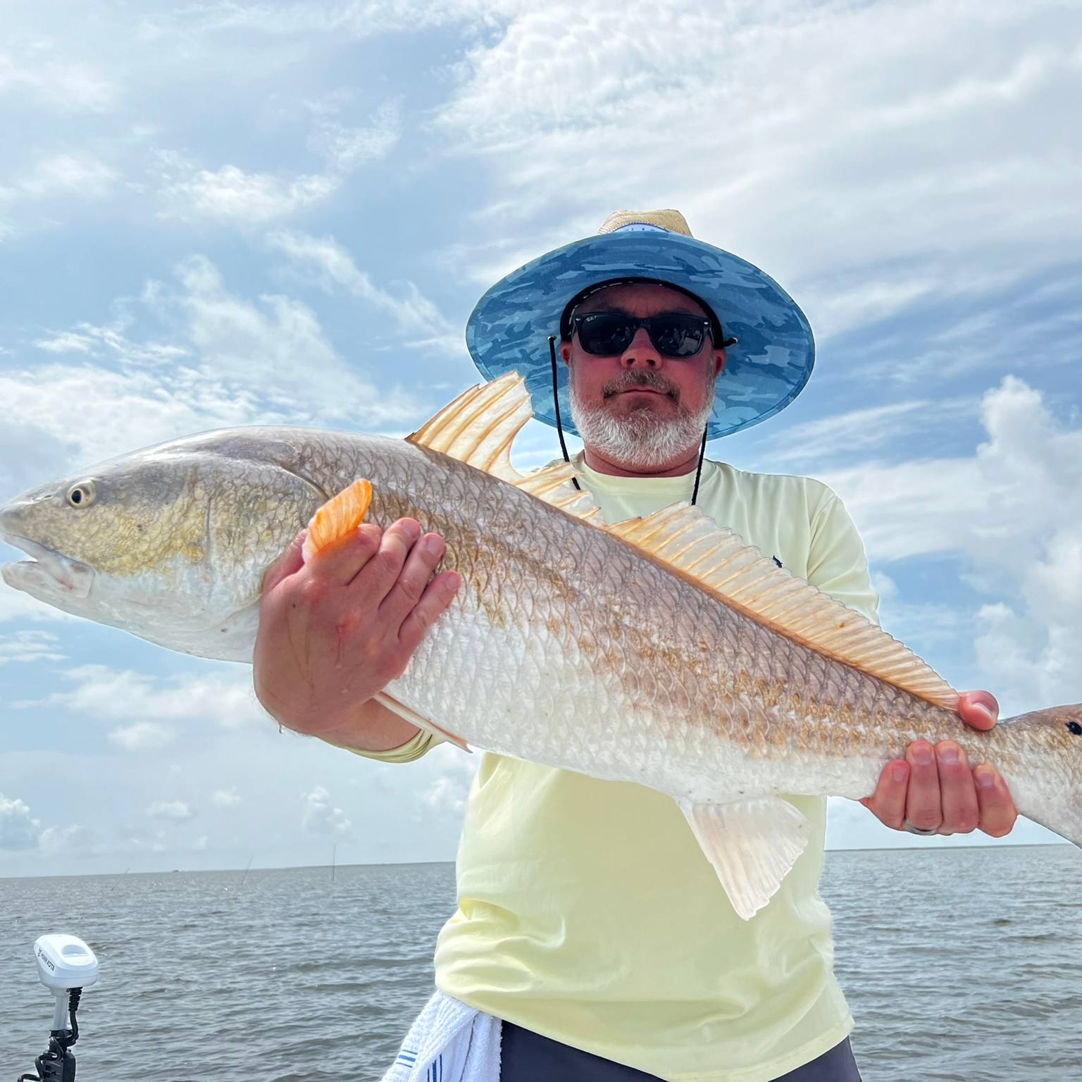 Angler holding a 30-inch fish in Slidell